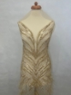 Picture of Long dress with golden crystals and feathers