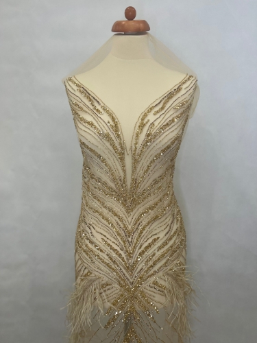 Picture of Long dress with golden crystals and feathers