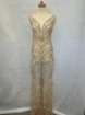 Picture of Long dress with golden crystals and feathers