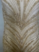 Picture of Long dress with golden crystals and feathers