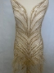 Picture of Long dress with golden crystals and feathers