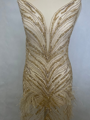 Picture of Long dress with golden crystals and feathers