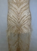 Picture of Long dress with golden crystals and feathers