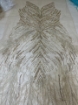 Picture of Long dress with golden crystals and feathers