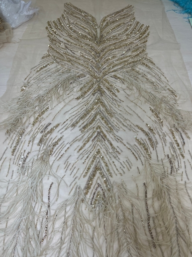 Picture of Long dress with golden crystals and feathers