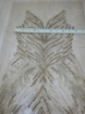 Picture of Long dress with golden crystals and feathers