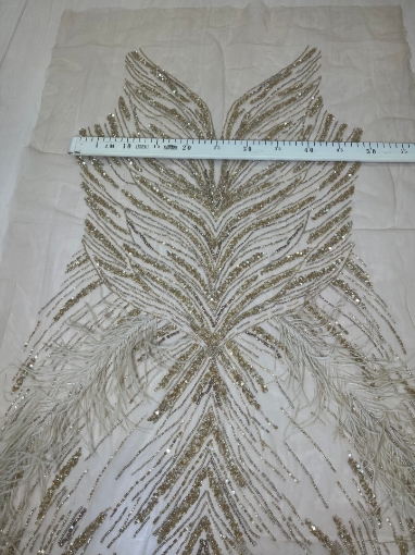 Picture of Long dress with golden crystals and feathers