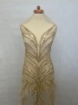 Picture of Long dress with golden crystals and feathers
