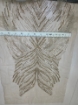 Picture of Long dress with golden crystals and feathers
