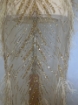 Picture of Long dress with golden crystals and feathers