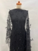 Picture of Beading with black feathers and beads