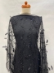 Picture of Beading with black feathers and beads