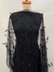 Picture of Beading with black feathers and beads
