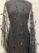 Picture of Beading with black feathers and beads