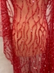 Picture of Embroidery with strings of red beads