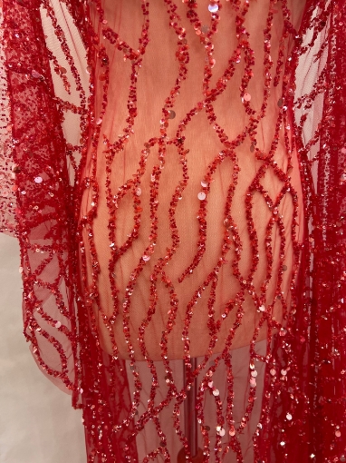 Picture of Embroidery with strings of red beads