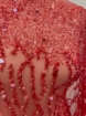Picture of Embroidery with strings of red beads