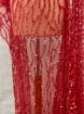 Picture of Embroidery with strings of red beads