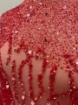 Picture of Embroidery with strings of red beads