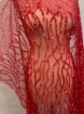 Picture of Embroidery with strings of red beads