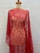 Picture of Embroidery with strings of red beads