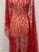 Picture of Embroidery with strings of red beads
