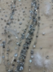 Picture of Feather embroidery with pearls and silver beads
