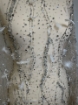 Picture of Feather embroidery with pearls and silver beads