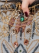 Picture of "Golden crystal and fringe embroidery"