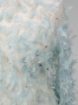 Picture of Spectacular embroidery with feathers and pearls.