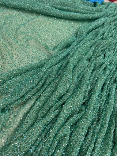 Picture of Mesh embroidery with green glass beads