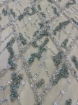Picture of Embroidery in shades of aquamarine, silver, and white