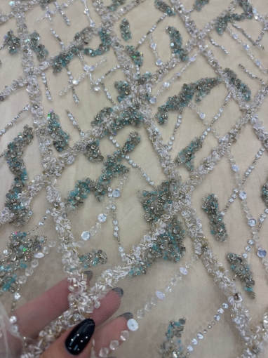 Picture of Embroidery in shades of aquamarine, silver, and white