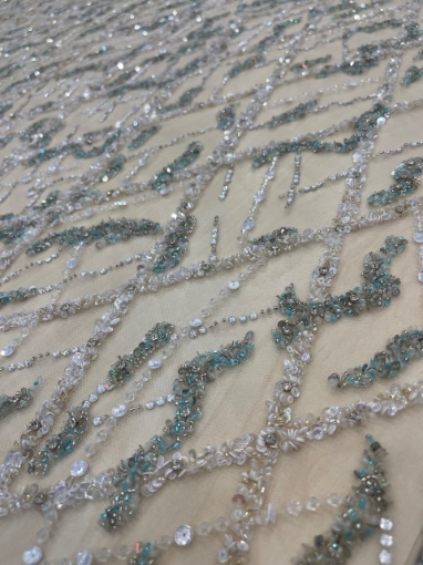 Picture of Embroidery in shades of aquamarine, silver, and white