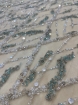 Picture of Embroidery in shades of aquamarine, silver, and white
