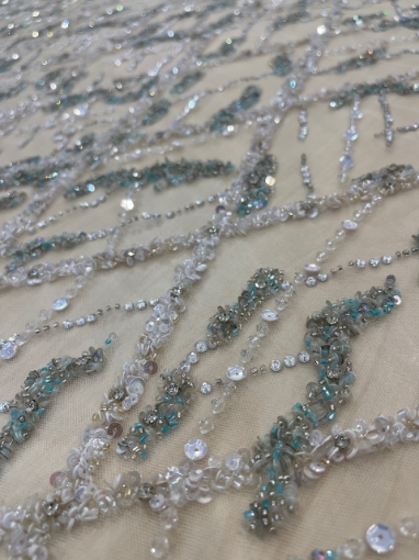 Picture of Embroidery in shades of aquamarine, silver, and white