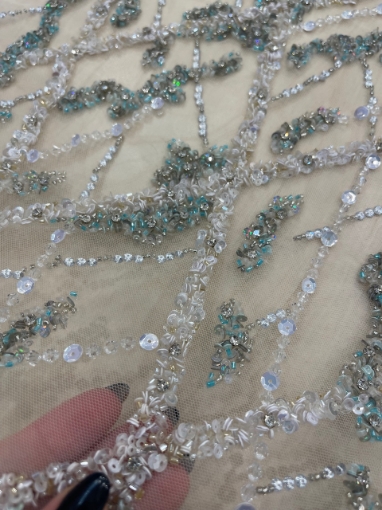 Picture of Embroidery in shades of aquamarine, silver, and white