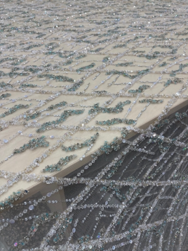 Picture of Embroidery in shades of aquamarine, silver, and white