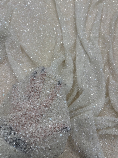 Picture of Mesh-type embroidery with pearls, beads, and white sequins.