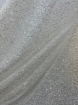 Picture of Mesh-type embroidery with pearls, beads, and white sequins.