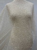 Picture of Mesh-type embroidery with pearls, beads, and white sequins.