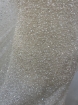 Picture of Mesh-type embroidery with pearls, beads, and white sequins.
