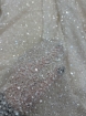 Picture of Mesh-type embroidery with pearls, beads, and white sequins.