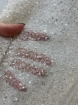 Picture of Mesh-type embroidery with pearls, beads, and white sequins.
