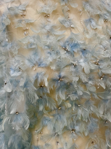 Picture of Spectacular embroidery with feathers and pearls.
