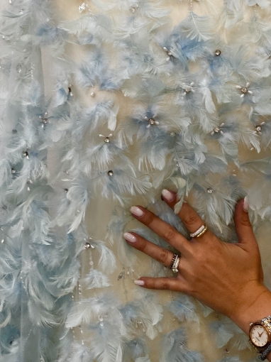 Picture of Spectacular embroidery with feathers and pearls.